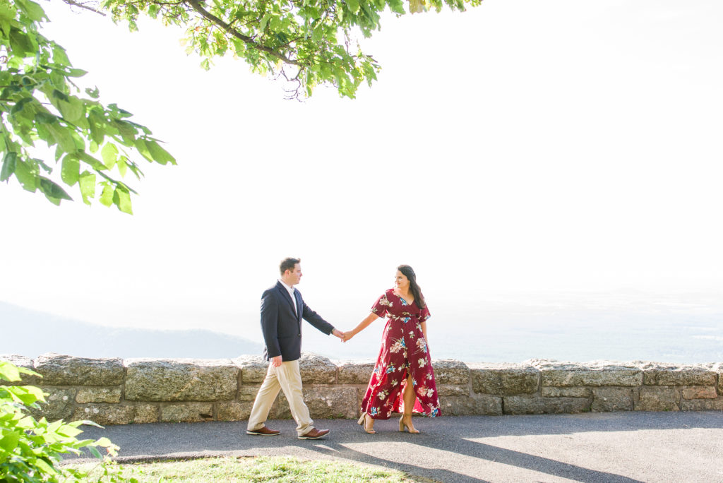 engagement photo of couple walking at Ravens Roost Overlook