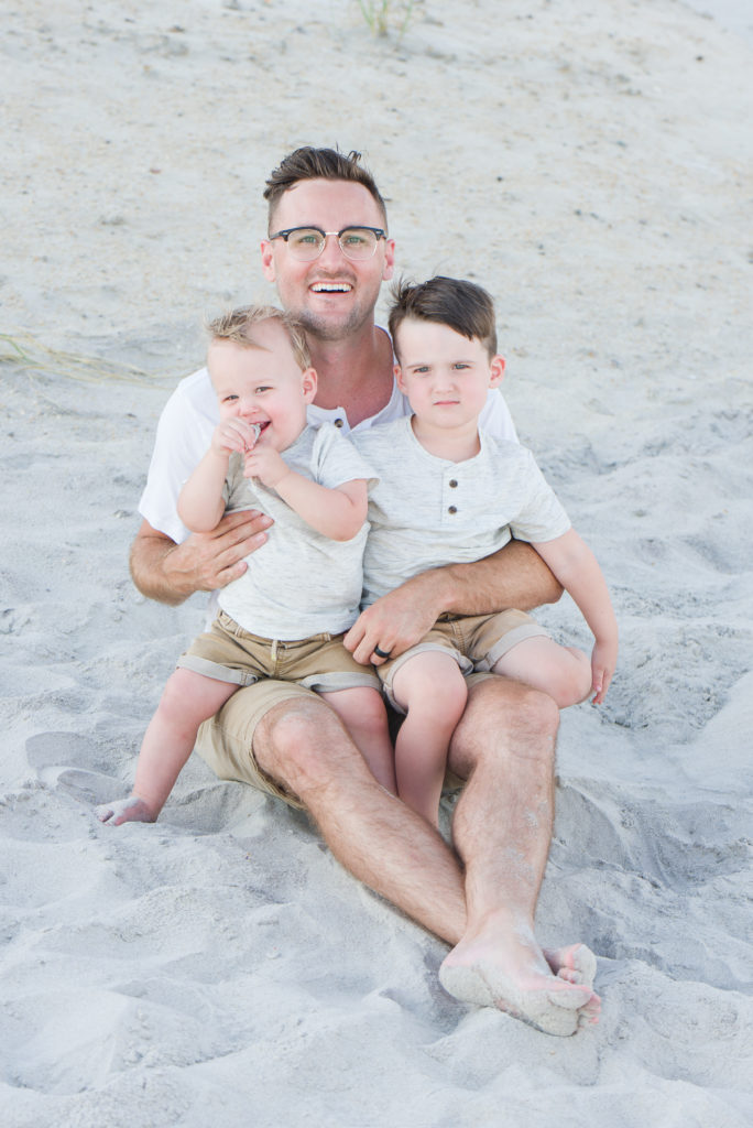 Father holding boys on Topsail Beach NC