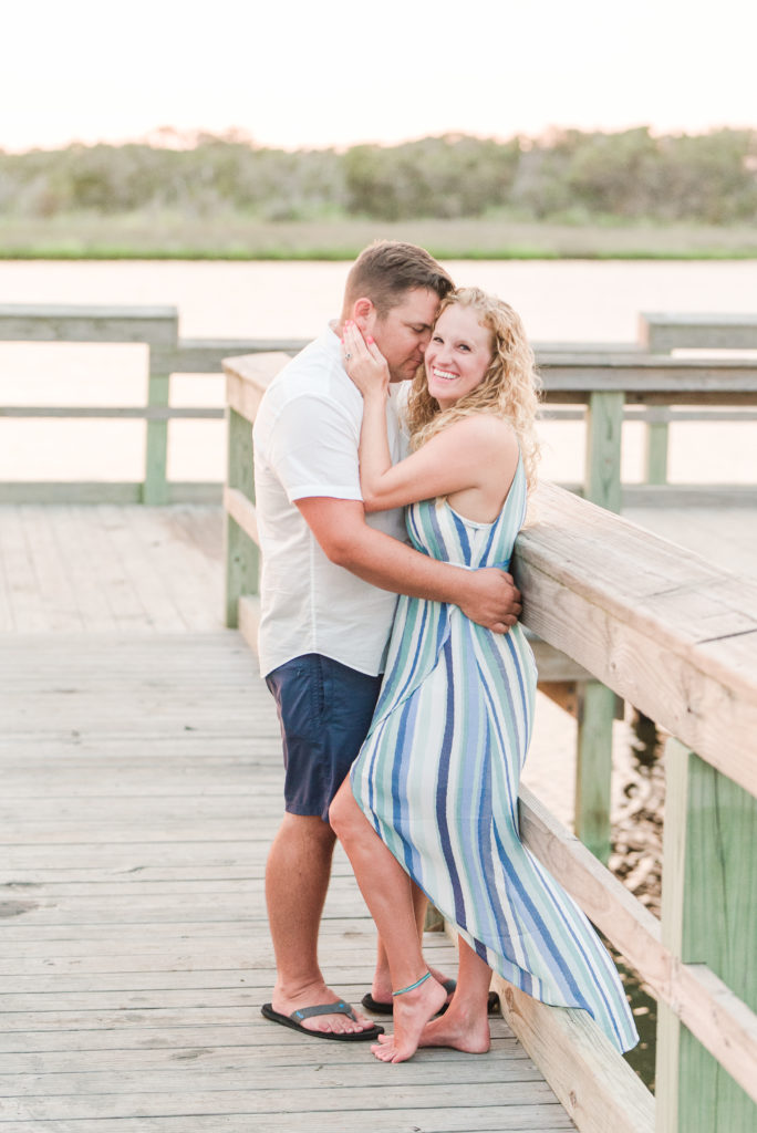 couple embracing on dock at NC sound
