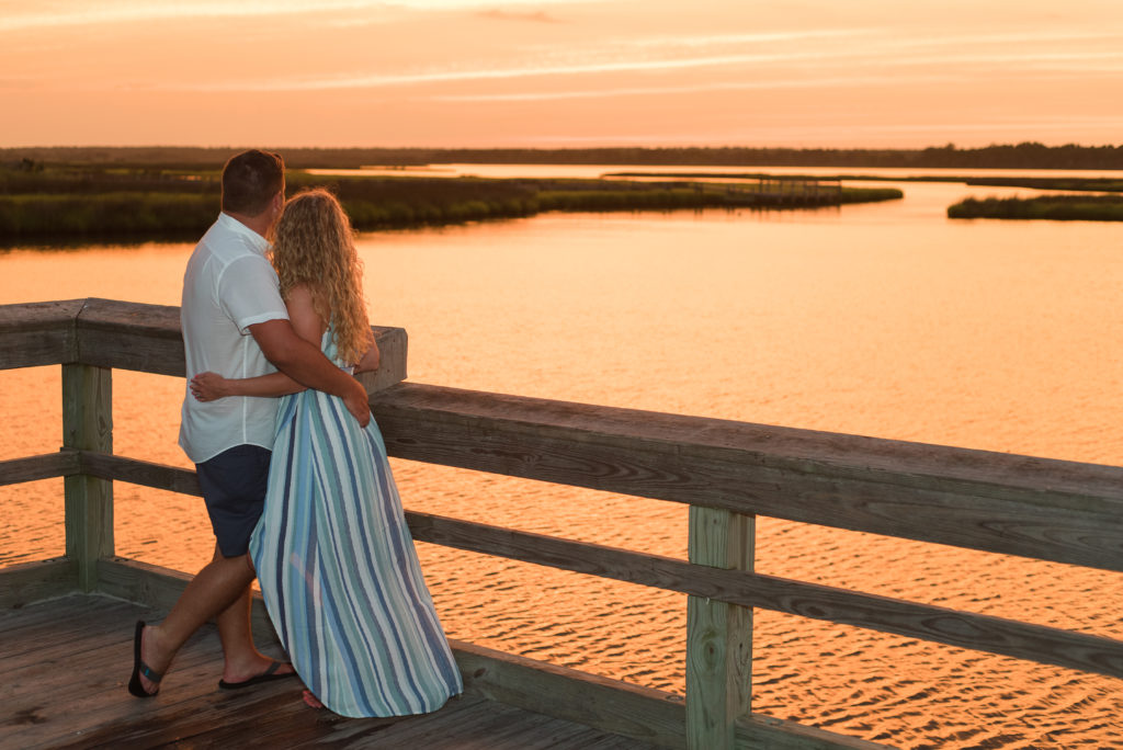 couple on dock at sunset Topsail Beach NC