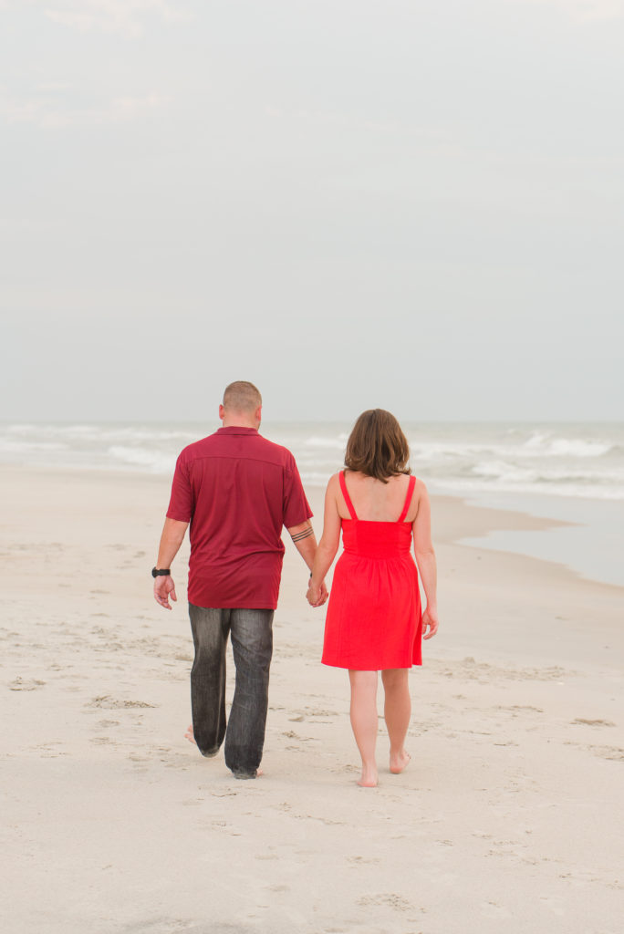 couple walking beach
