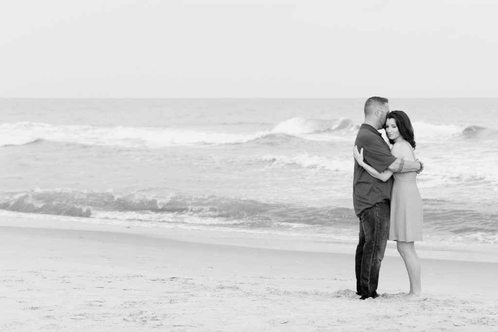 couple hugging on beach