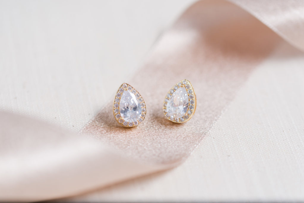 diamond earrings on champagne color ribbon