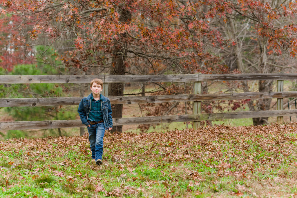 child outdoor in fall foliage