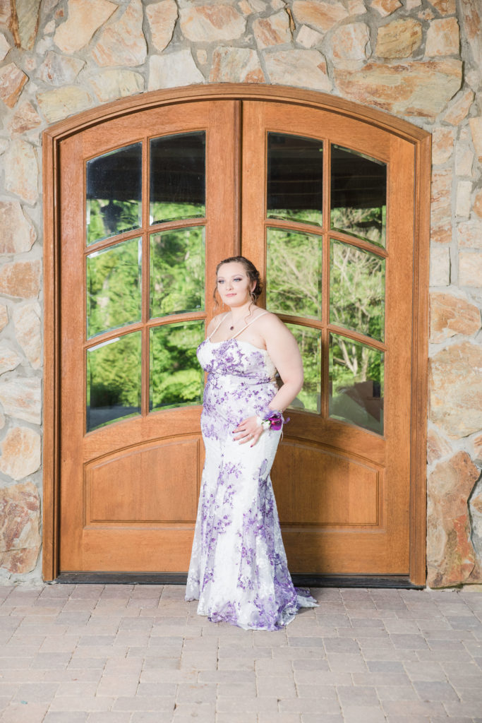 senior portrait prom dress in front of beautiful door
