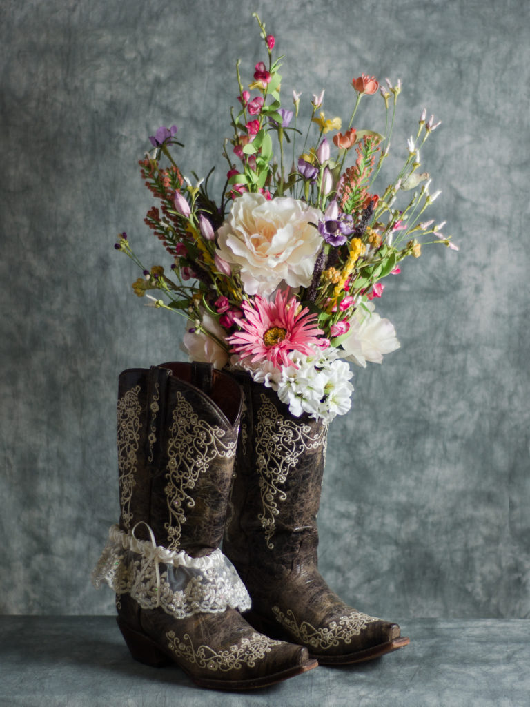 cowboy wedding boots with rustic bouquet
