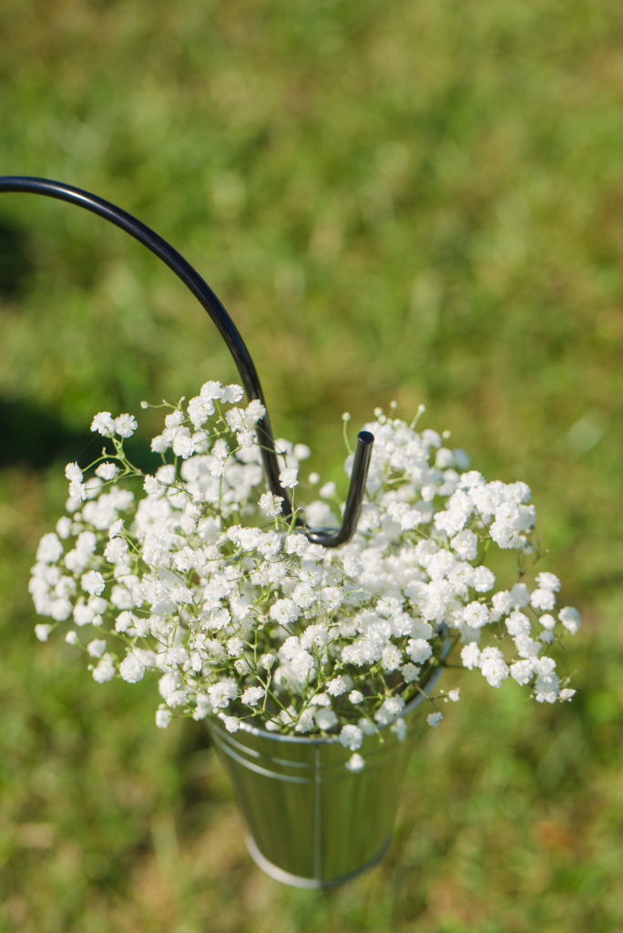small metal bucket with baby's breath