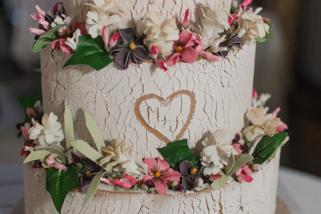 bride and groom initials on rustic inspired wedding cake