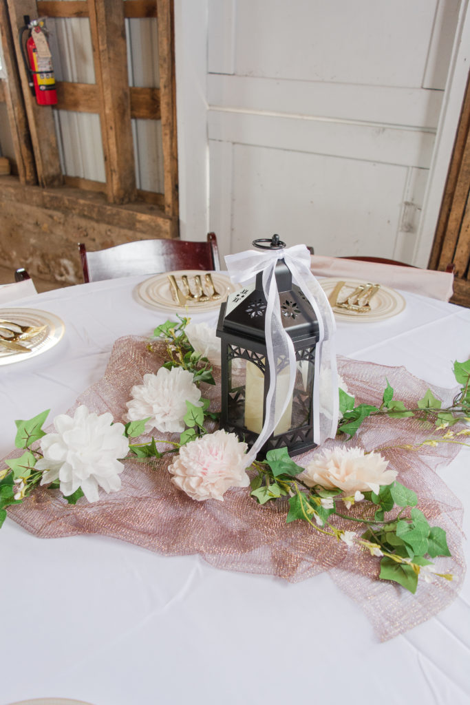 rustic wedding reception detail lantern with flowers