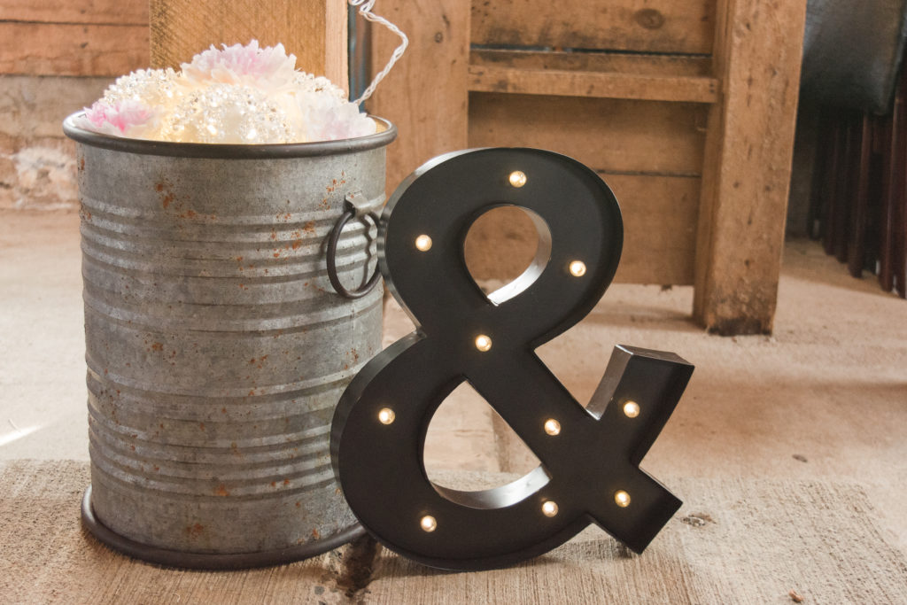 metal bucket and ighted sign for wedding reception decor