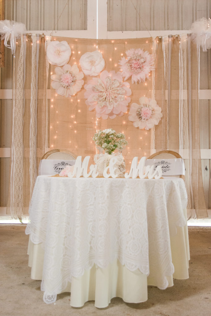 rustic sweetheart table at wedding reception