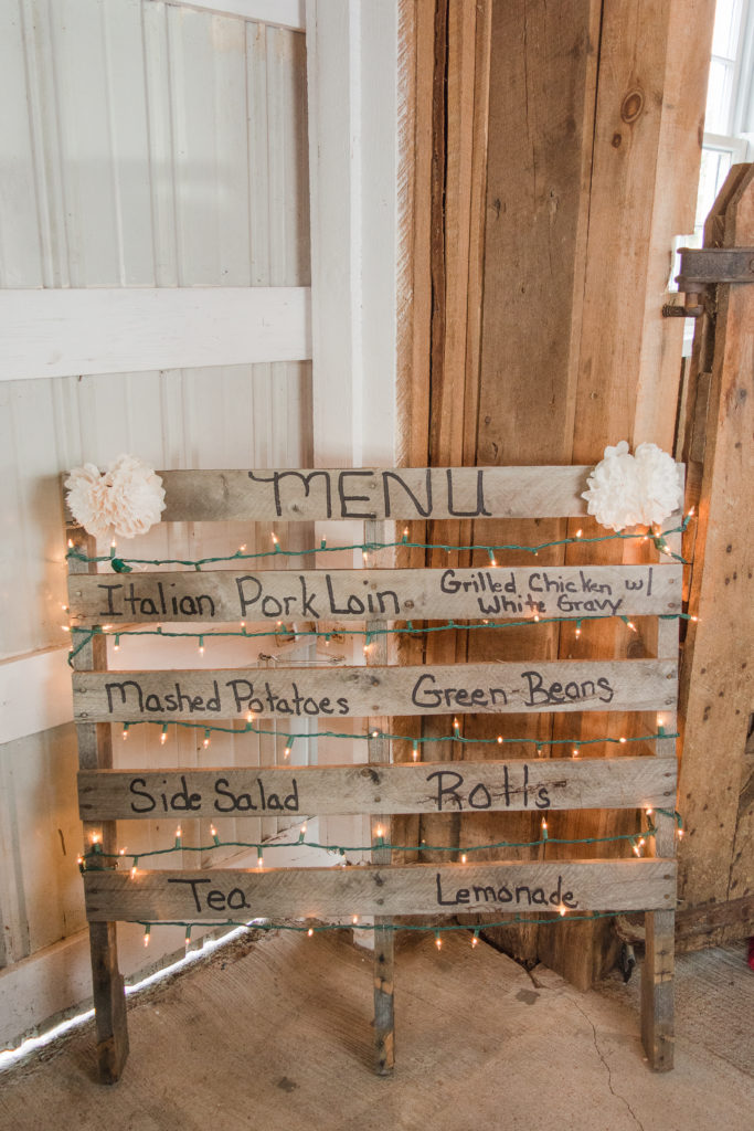 wooden pallet sign listing rustic wedding reception menu