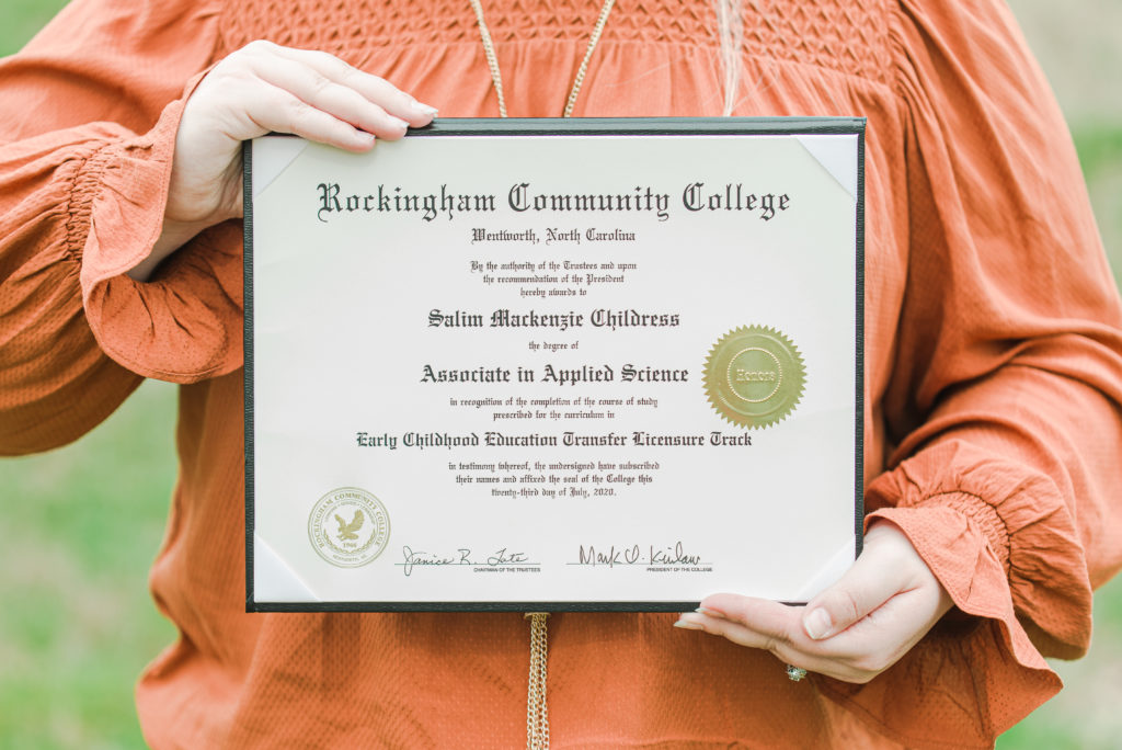 Senior holding diploma from Rockingham Community College 