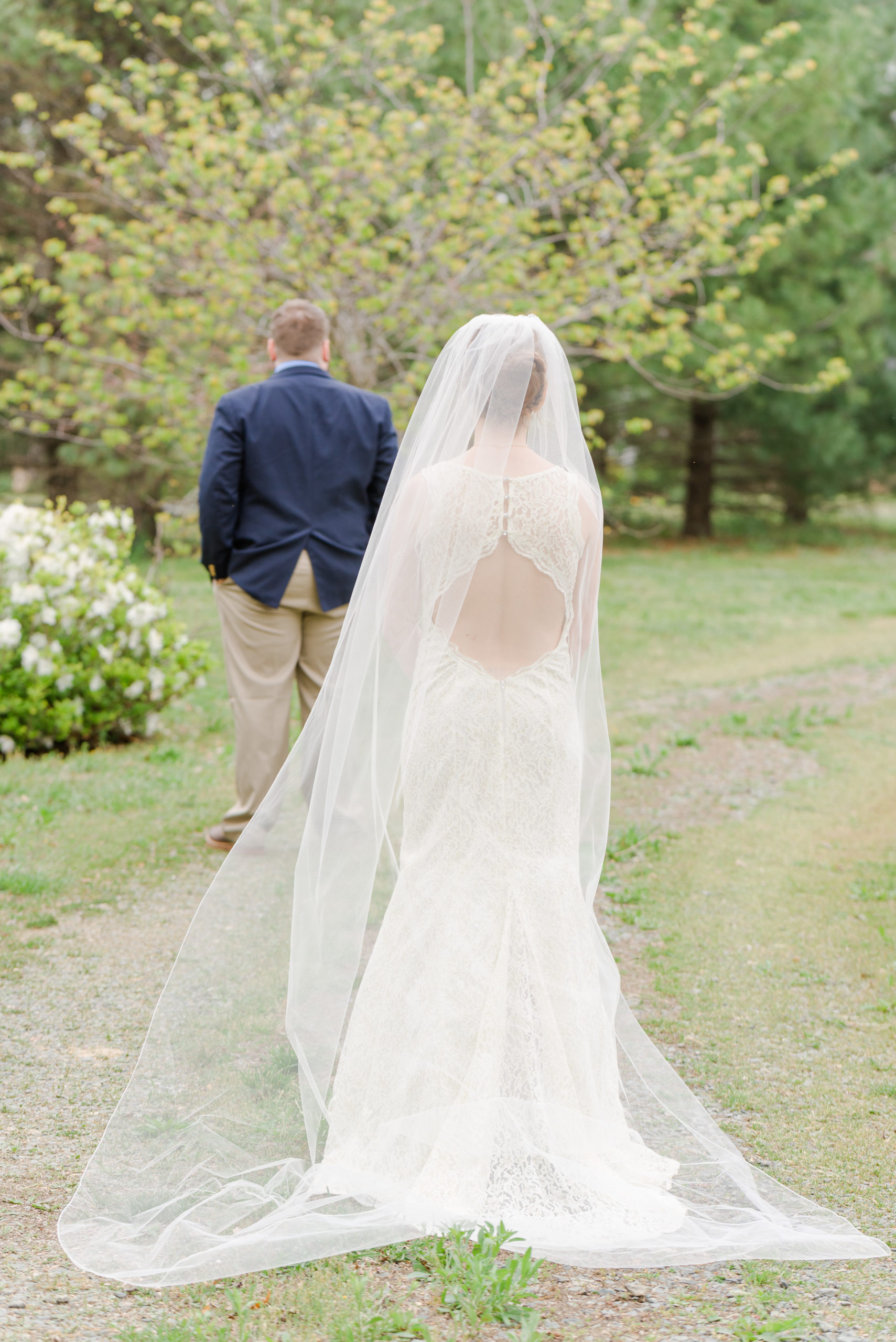 bride walking towards groom for first look