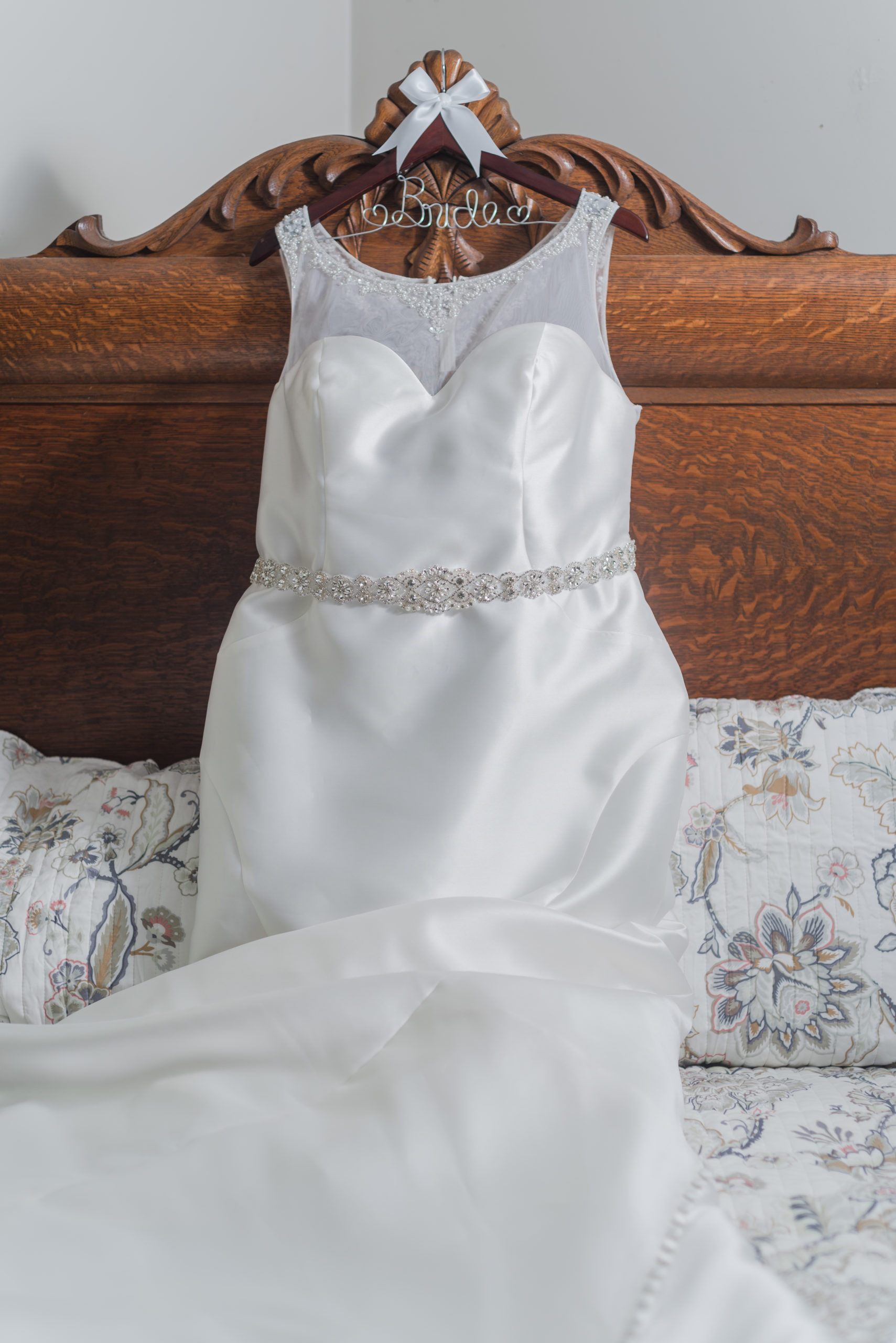 wedding dress on antique bed