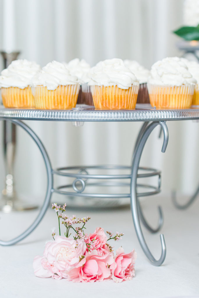pink flowers and cupcakes for cake table at styled shoot