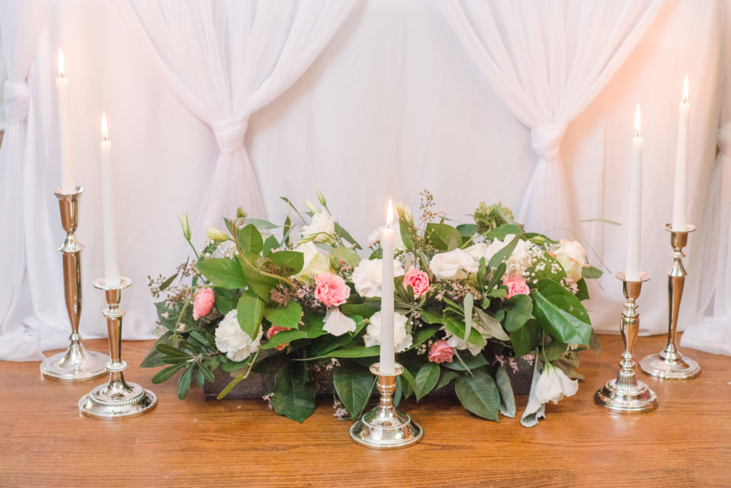 floral arrangement for styled shoot with silver candlesticks