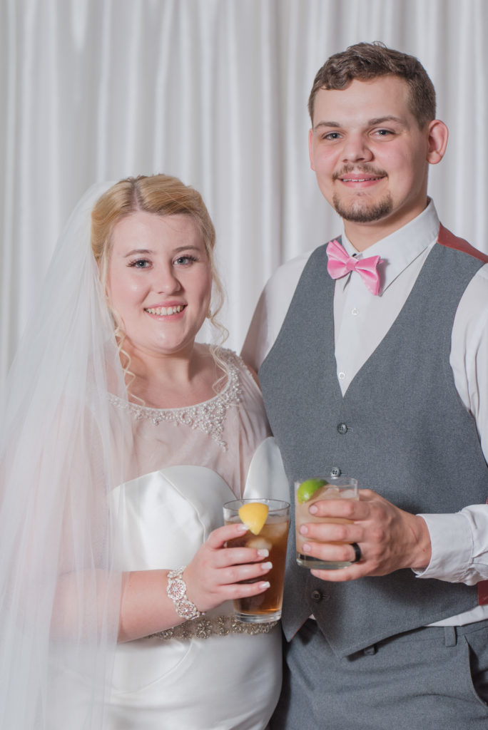 bride and groom with their signature cocktails