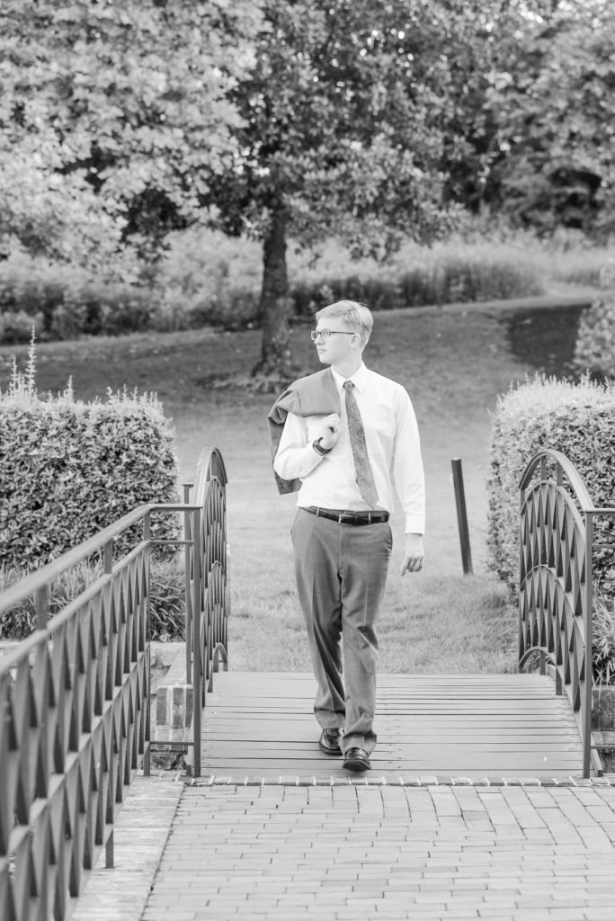 Senior portrait walking on bridge