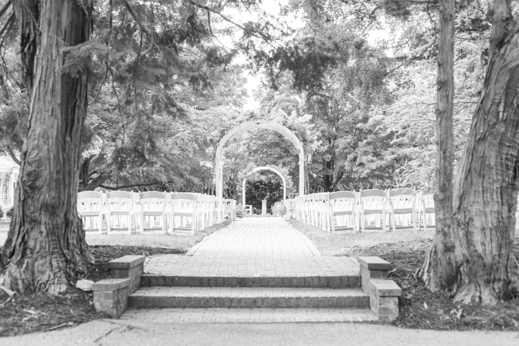 Garden Wedding with arch and mature trees