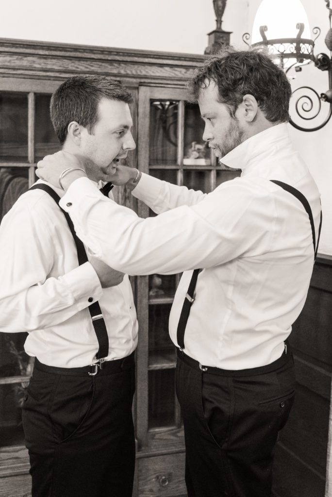 groomsmen adjusting collar