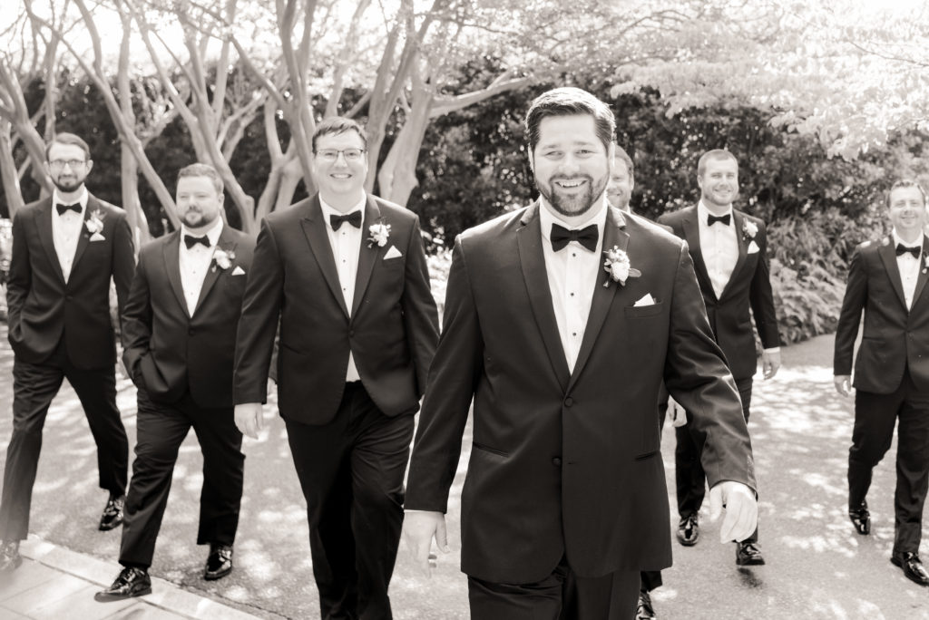 groom walking with groomsmen