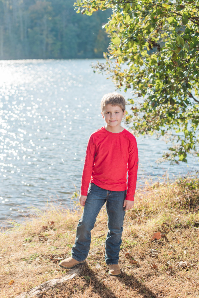 child standing on lake shore  - James' 8th Birthday