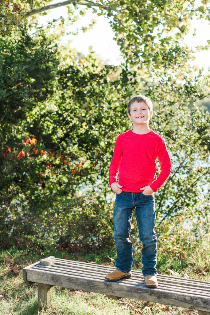 child standing on bench - James' 8th Birthday