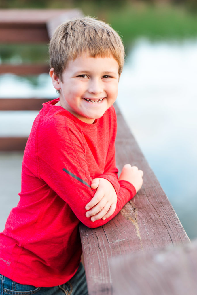 child leaning on dock for 8 year old portrait