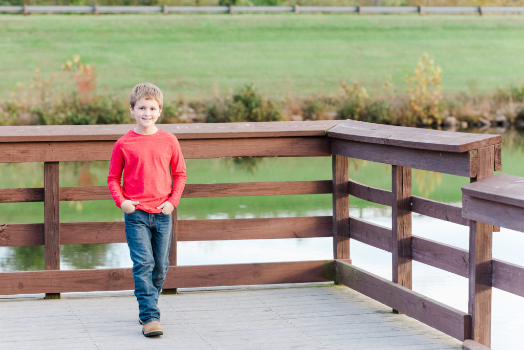 child walking on dock on lake - James' 8th Birthday