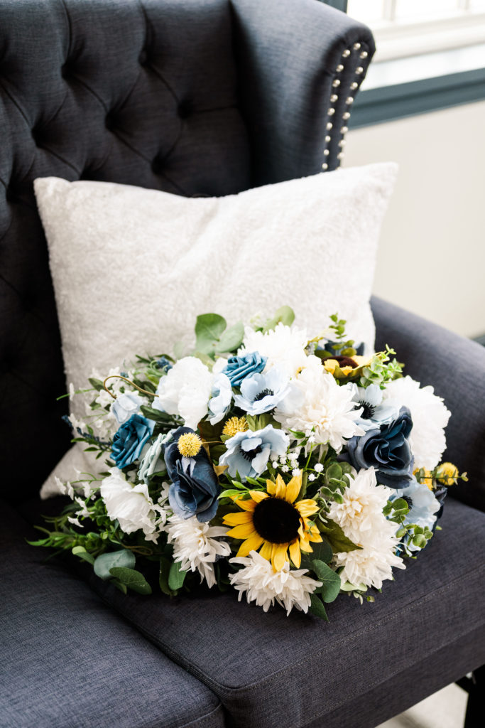 wedding bouquet on blue couch at the Osprey's at Belmont Bay, Woodbridge Virginia