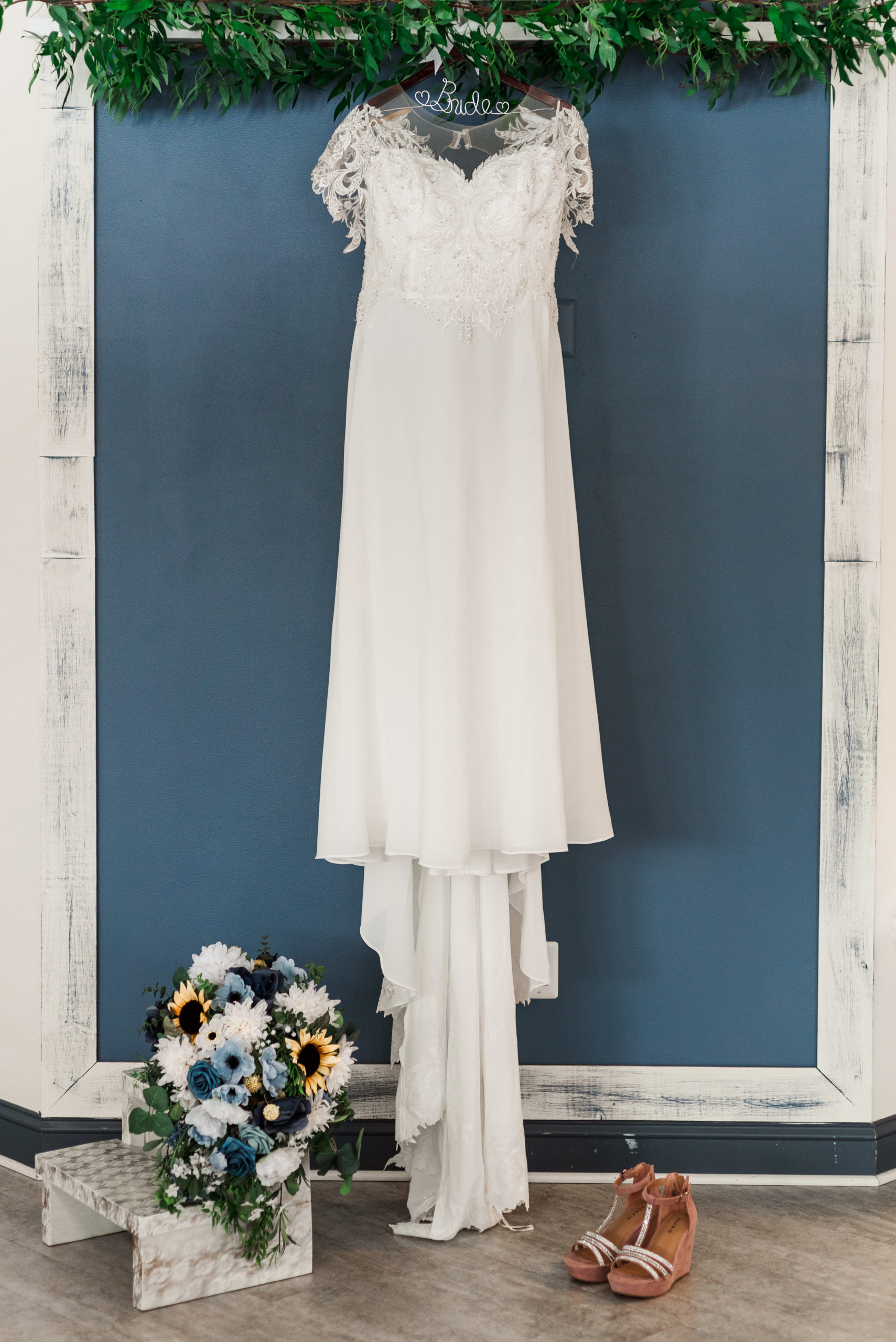 wedding gown with bouquet and shoes