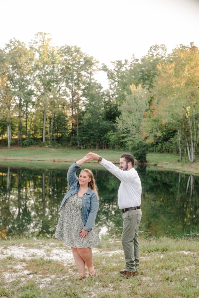 couple dancing during engagement session in Madison, NC