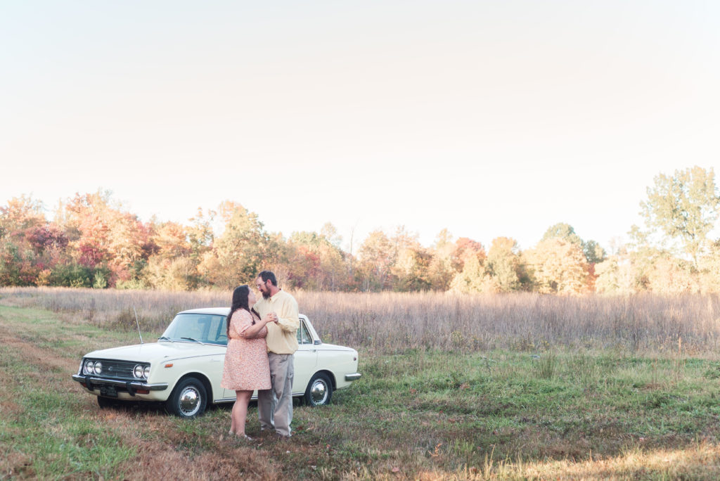 engagement portrait with fall colors and antique car