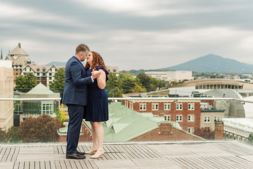 couple dancing Engagement Session at Center in the Square Rooftop