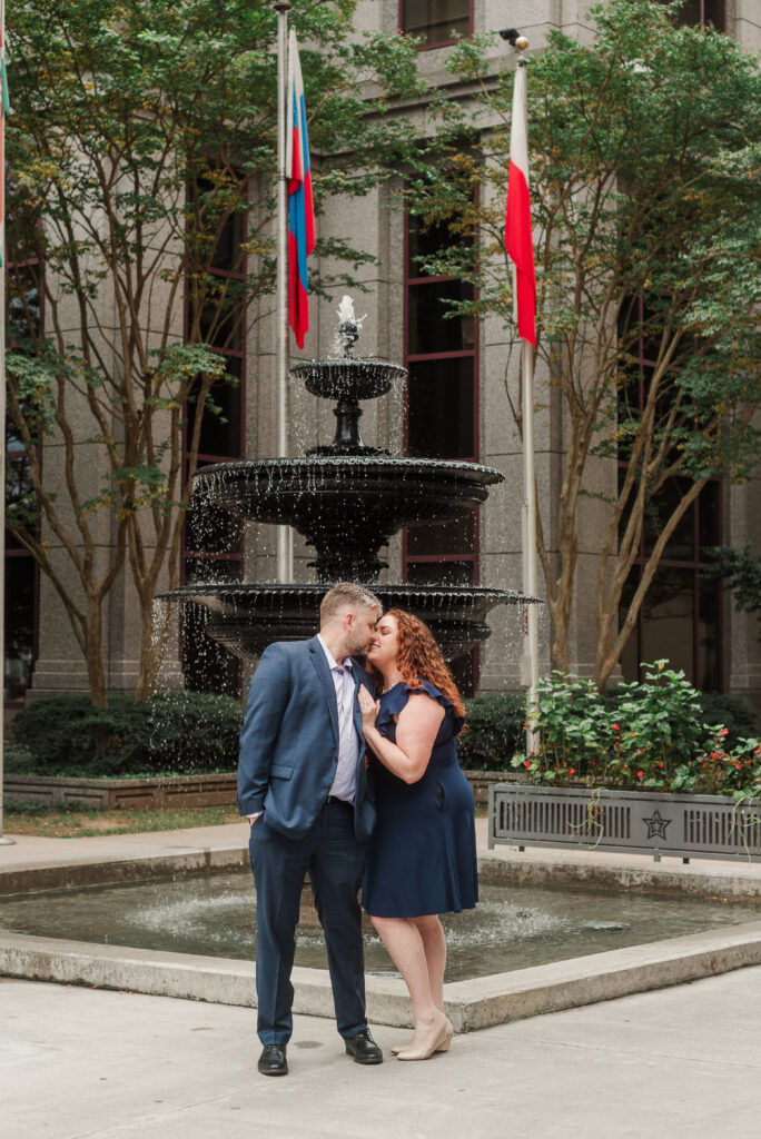 couple kissing by fountain in Downtown Roanoke Virginia
