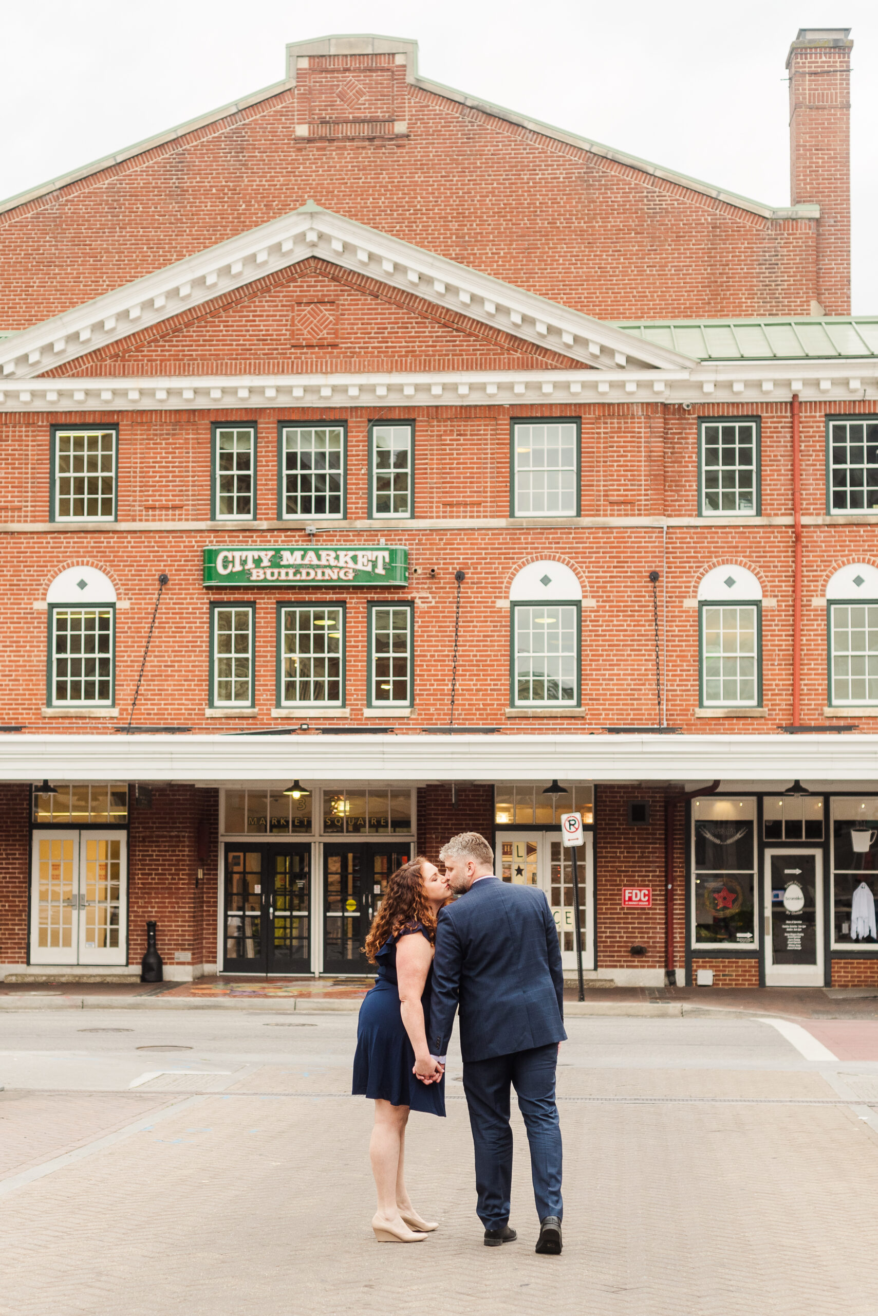 couple kissing by the City Market Building in Roanoke Virginia