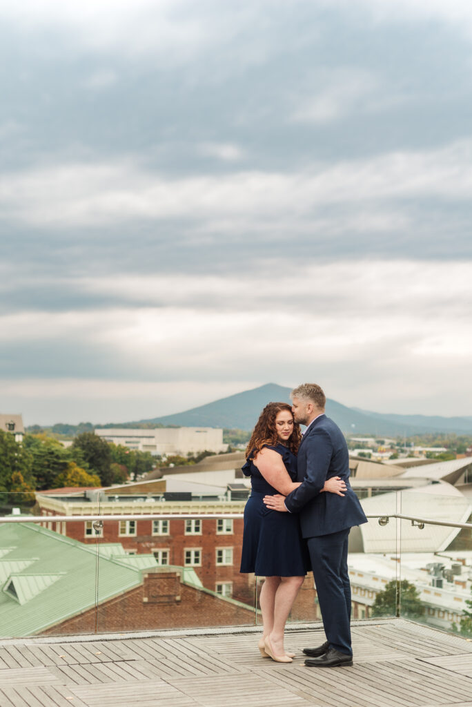 couple hugging rooftop in Roanoke Virginia