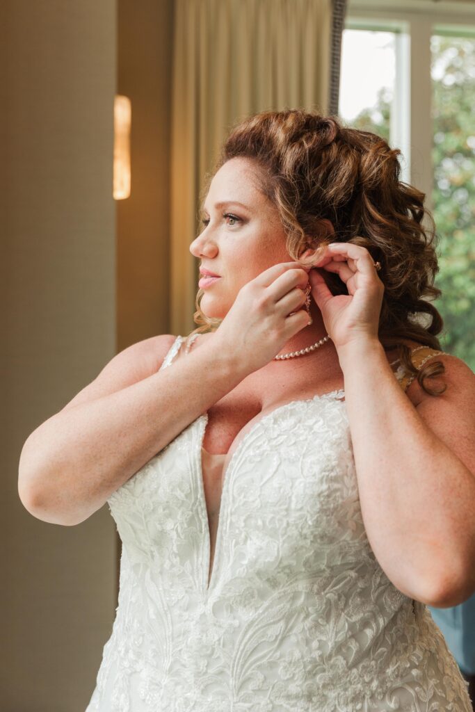 bride adjusting earring