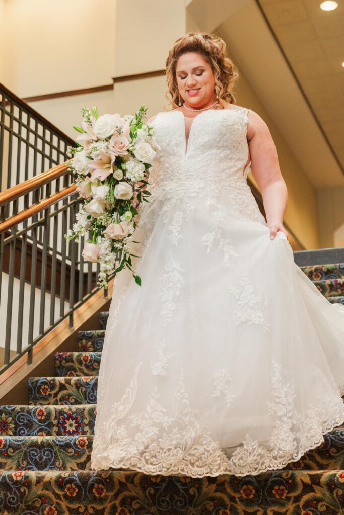 bride walking down the stairs at The Hotel Roanoke