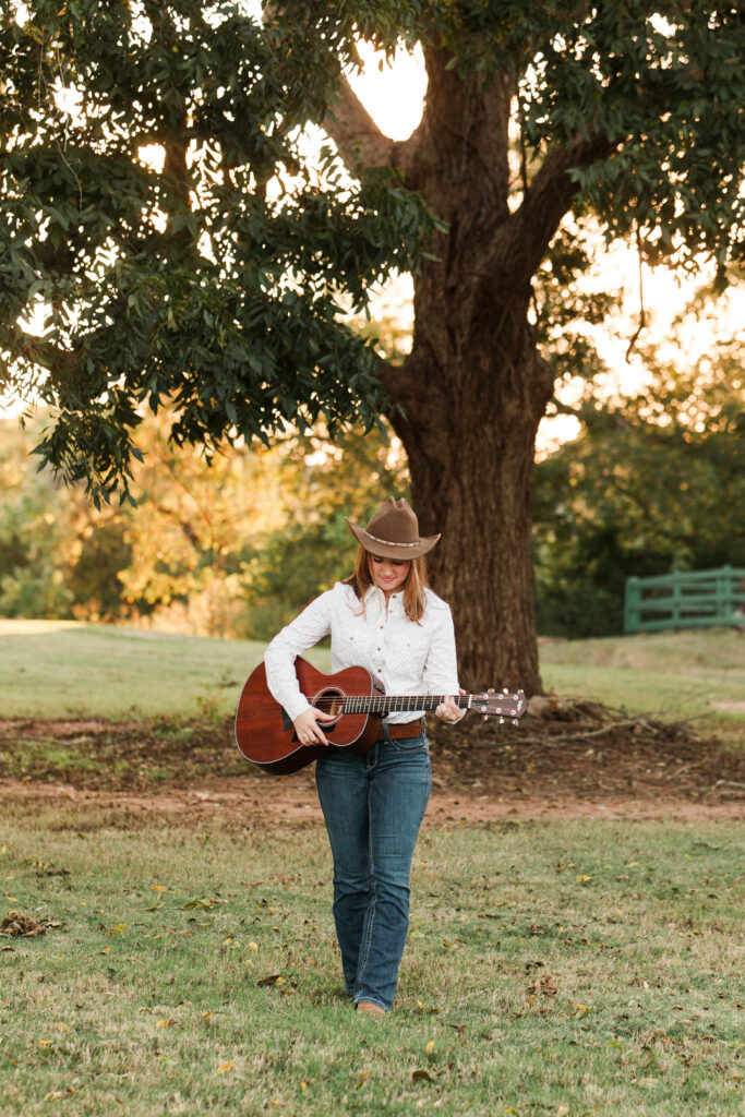 Senior portraits with guitar and cowboy hat