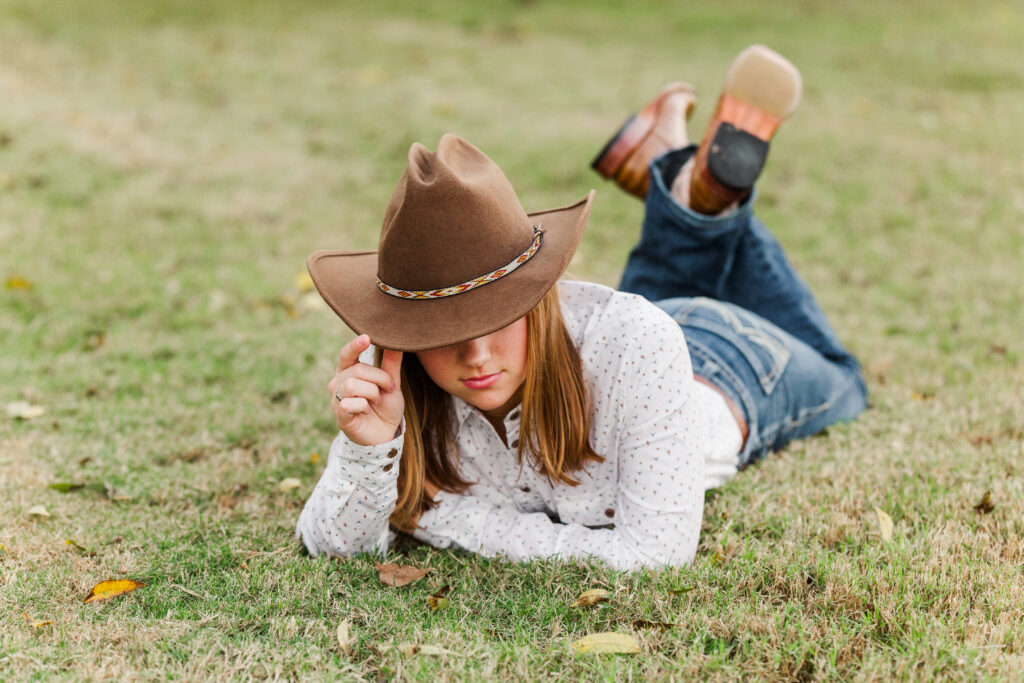 Senior portraits with cowboy hat and boots