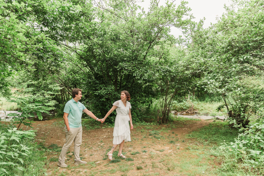 Couple walking during Engagement Session at Bold Rock Hard Cider, Nellysford, Virginia