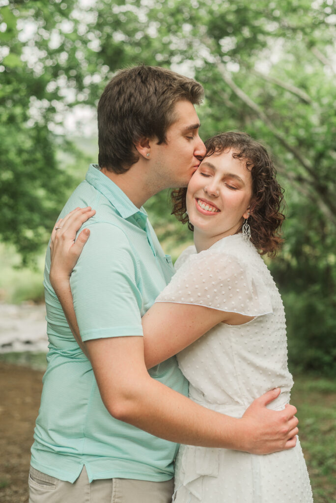 Groom kissing Bride during Engagement Session at Bold Rock Hard Cider, Nellysford, Virginia