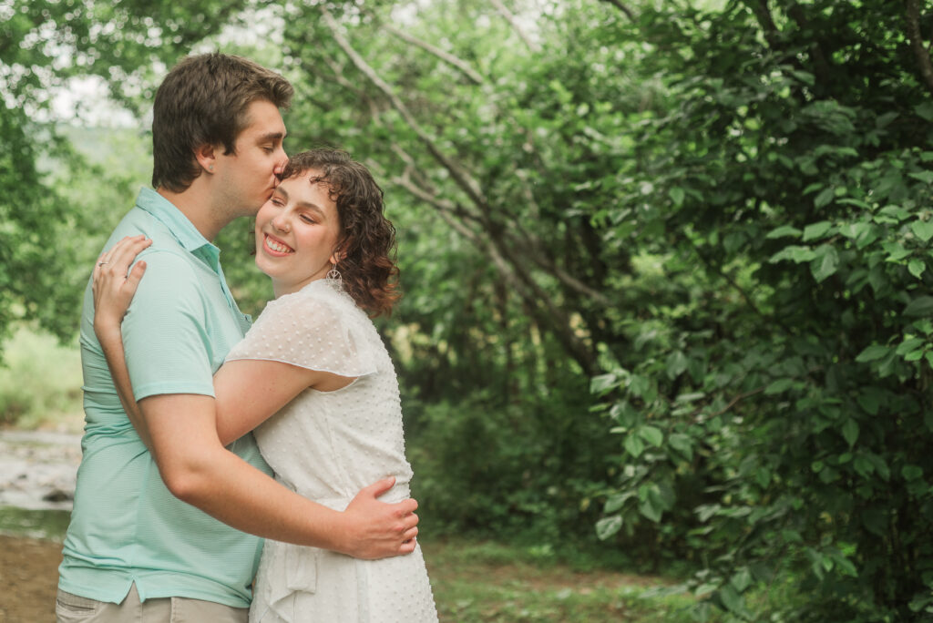 couple embracing during Engagement Session at Bold Rock Hard Cider, Nellysford, Virginia