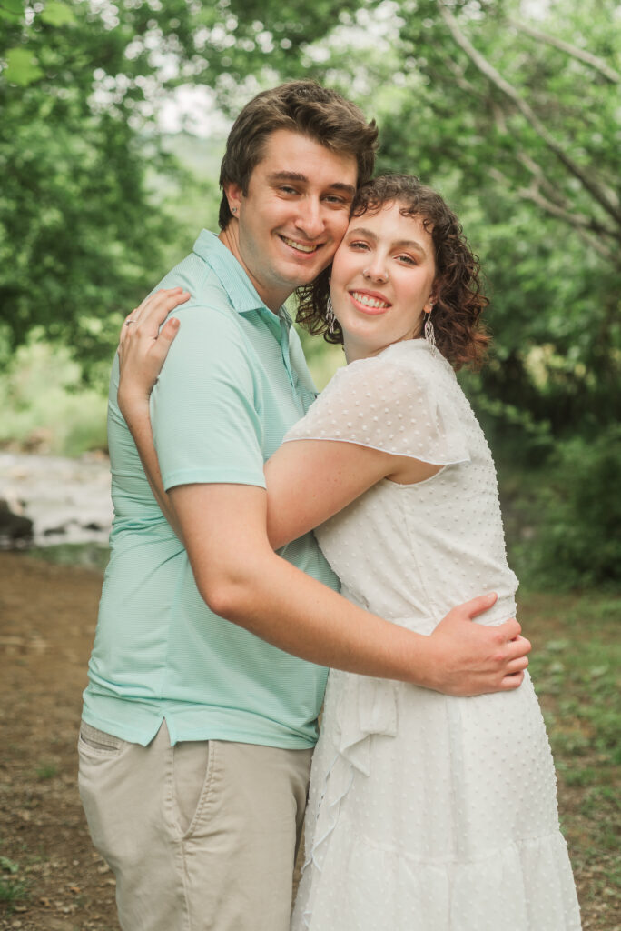 Couple hugging during Engagement Session at Bold Rock Hard Cider, Nellysford, Virginia