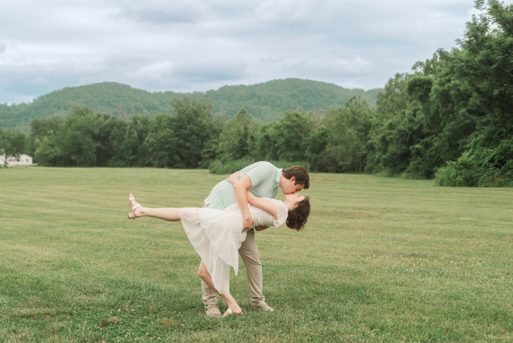 Couple doing a dip during Engagement Session at Bold Rock Hard Cider, Nellysford, Virginia