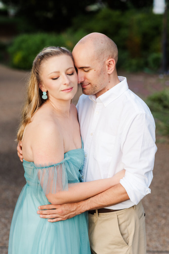 couple nuzzling for engagement session