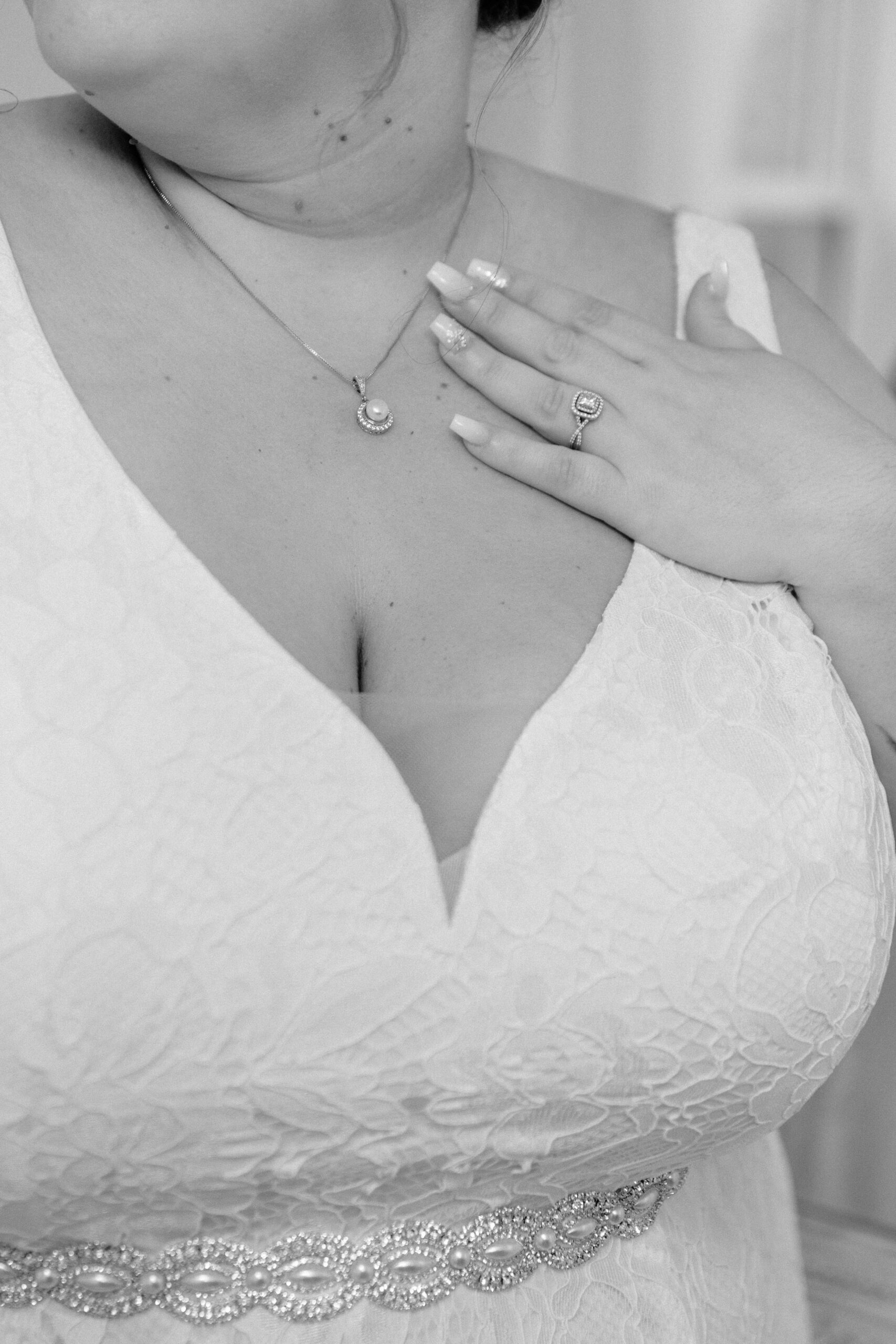 bride touching necklace