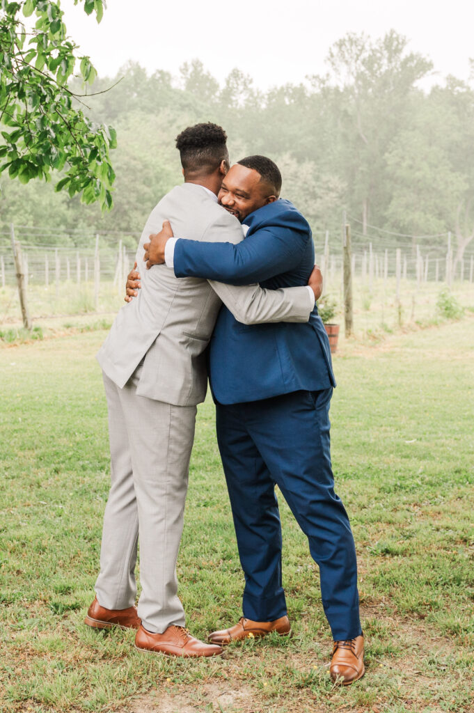 groom hugging groomsmen